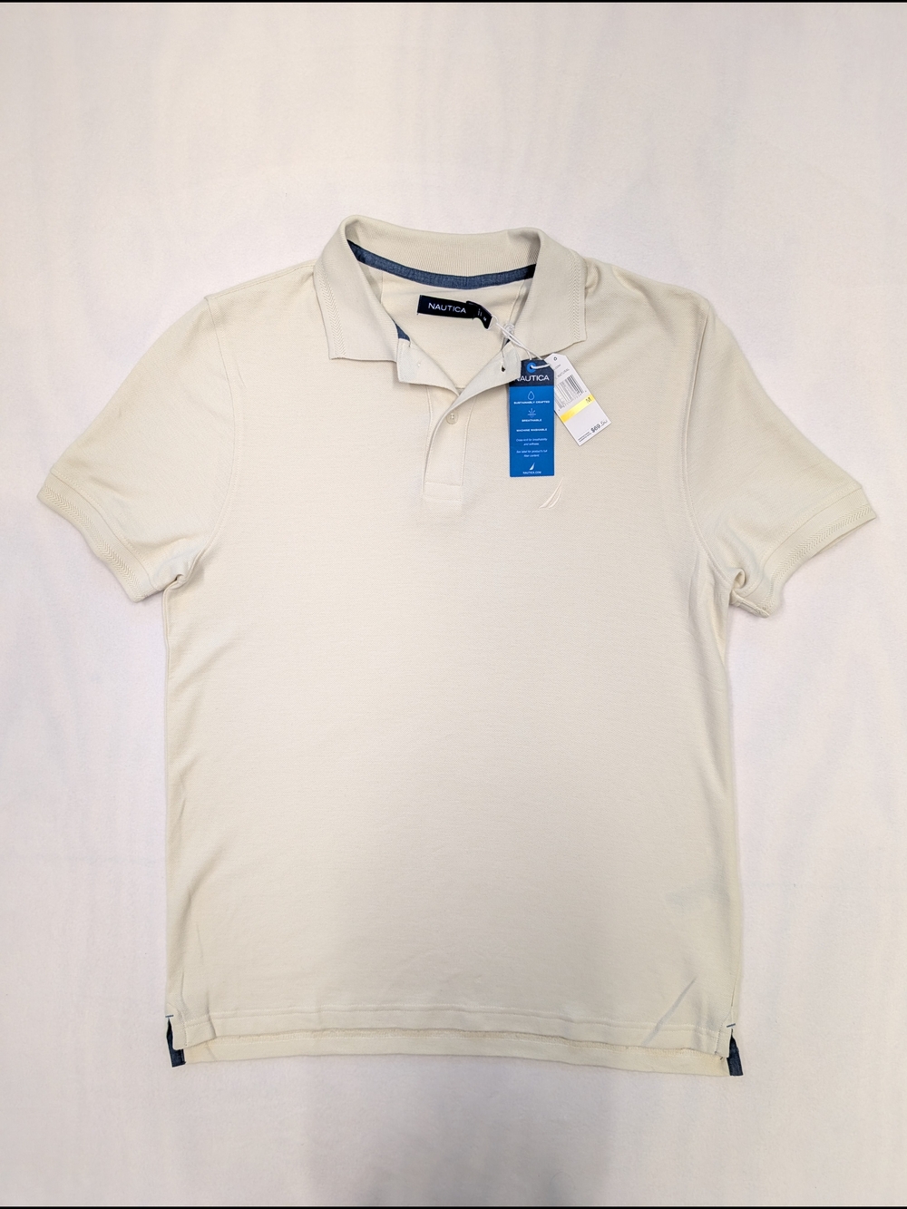Nautica polo shirt features a structured collar and a classic embroidered logo